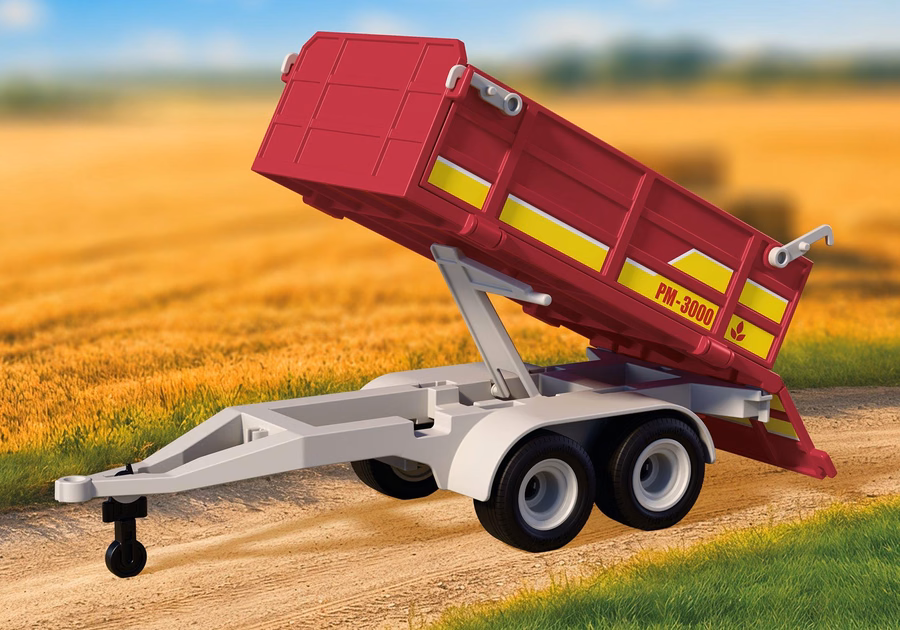 Vrachtwagen met oplegger en hooibalen