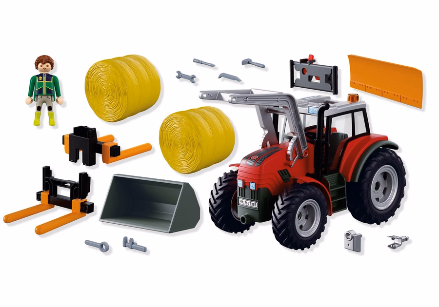 Grote tractor met hooibalen